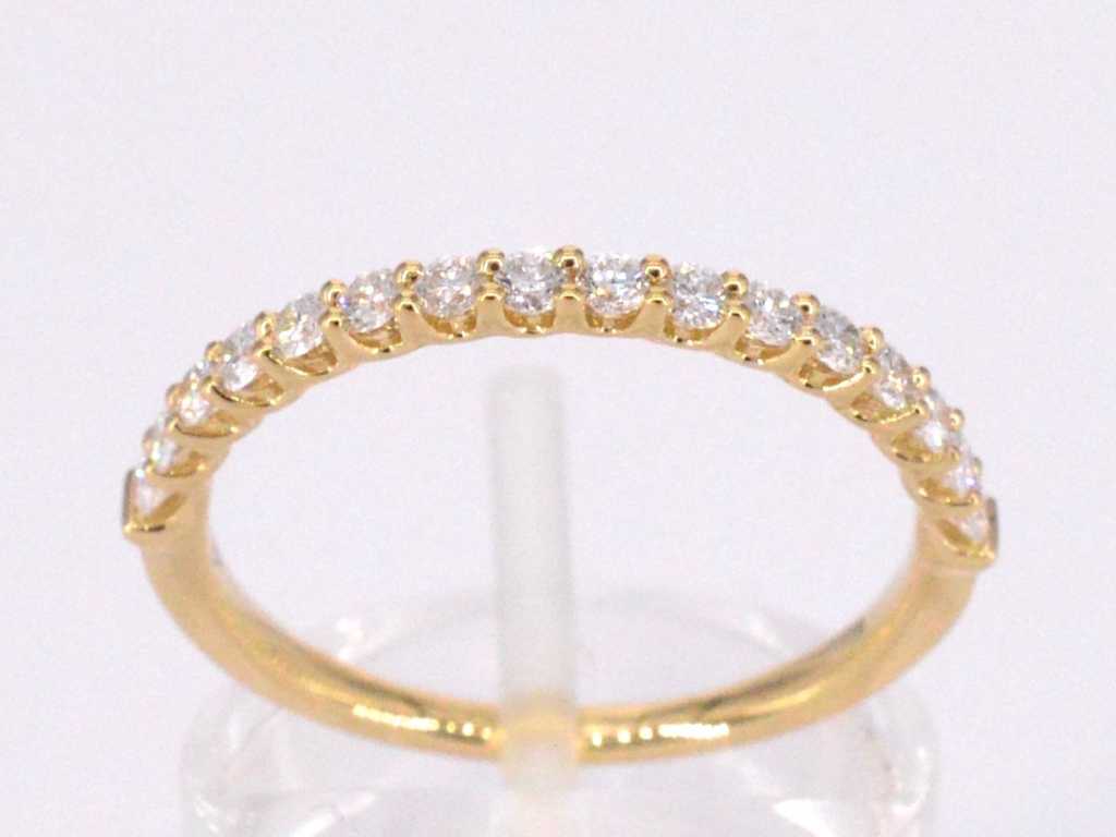 Gold row ring set with brilliant-cut diamonds