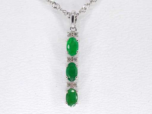 White gold pendant with diamonds and emerald
