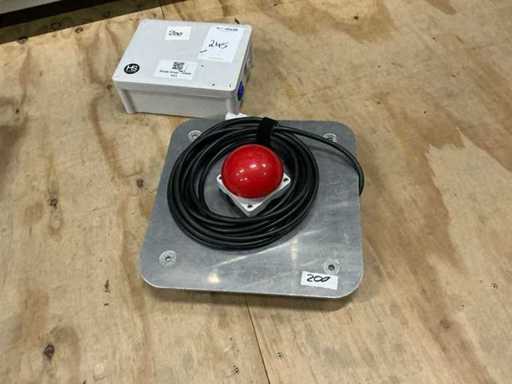 Red button on base plate with relay box