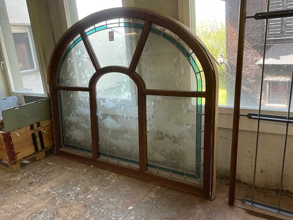 Arched window with decorative glass