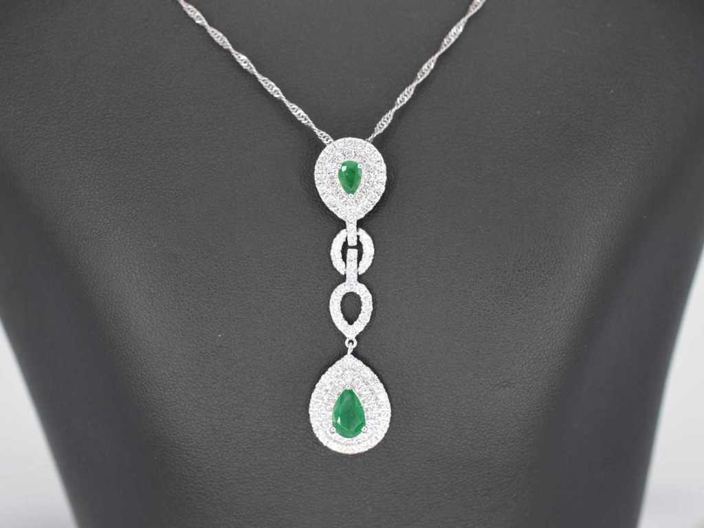 White gold pendant with diamonds and emeralds set