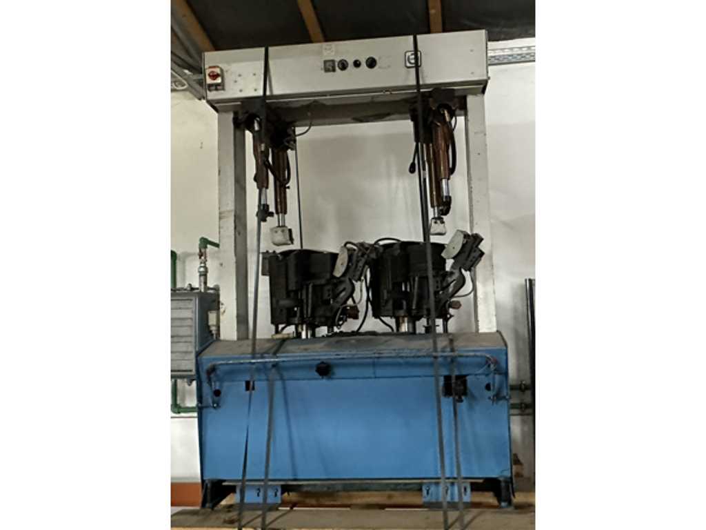 Two station hydraulic sole press with pads for walled soles