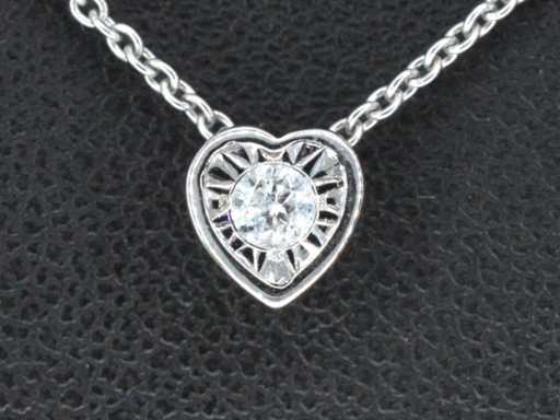 White gold pendant with a brilliant-cut diamond in heart shape