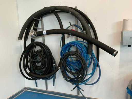 Connection hoses on wall rack