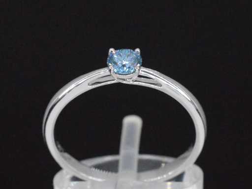 Bague en or blanc avec diamant bleu