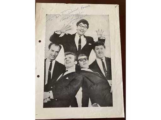 Signed page from a program booklet Freddie and the Dreamers