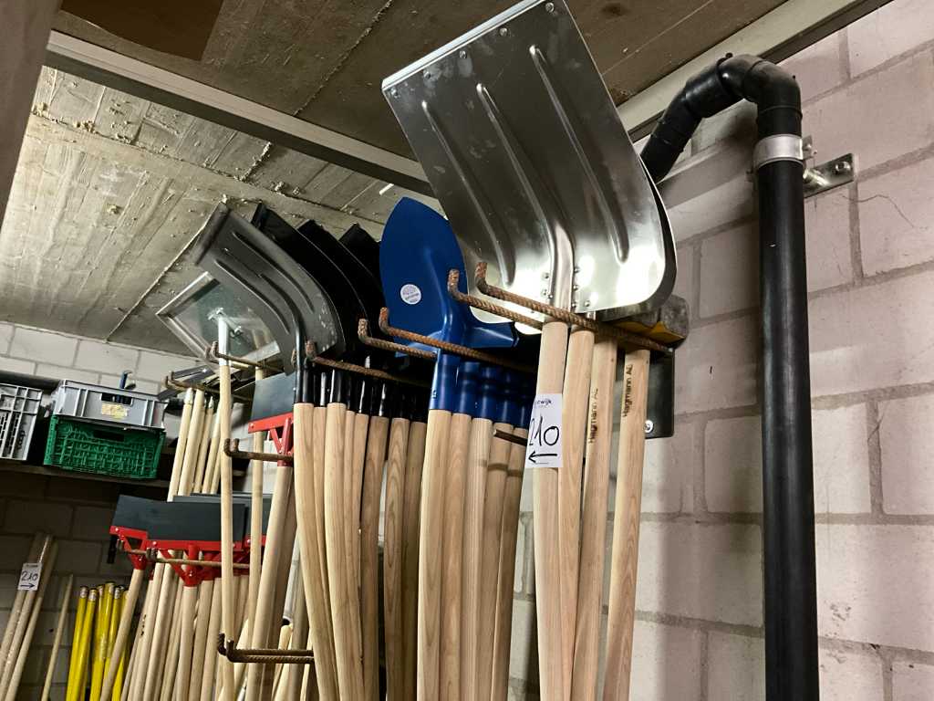 Lots of brooms, scrapers, handles and miscellaneous