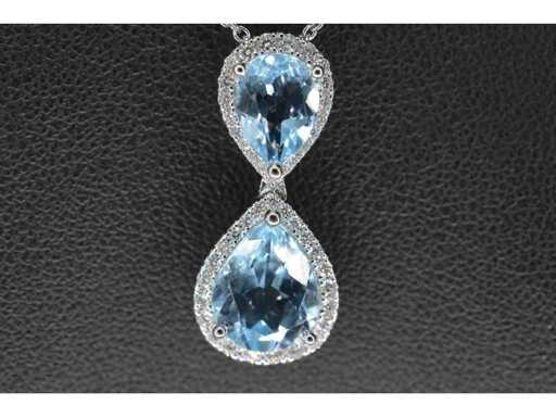 White gold entourage pendant with topaz and diamonds