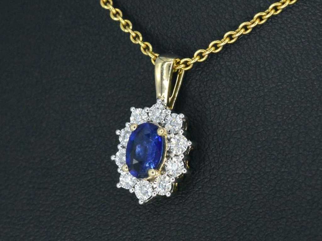 Gold entourage pendant with diamonds and sapphire