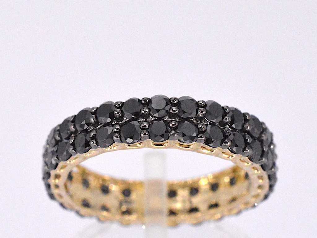 Gold eternity ring with black diamonds