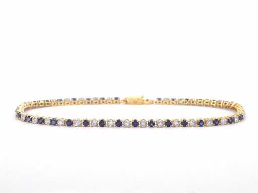 Gouden tennisarmband met diamanten en saffieren