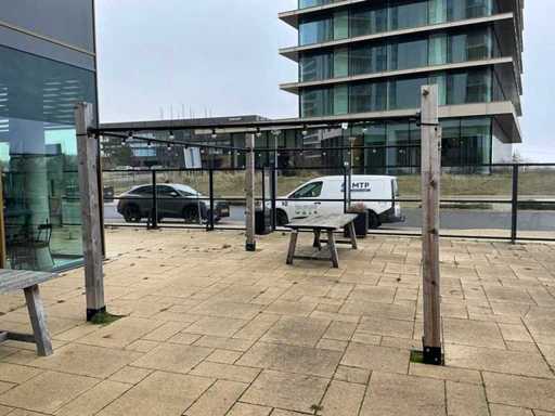 Scaffold tube frame with wooden poles for shade cloth