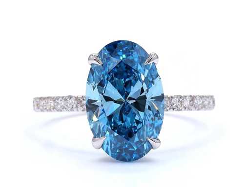 18 Karaat witgouden ring met 3 crt. blauwe diamant