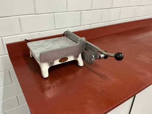 Unika - tagliaformaggio a mano riscaldato