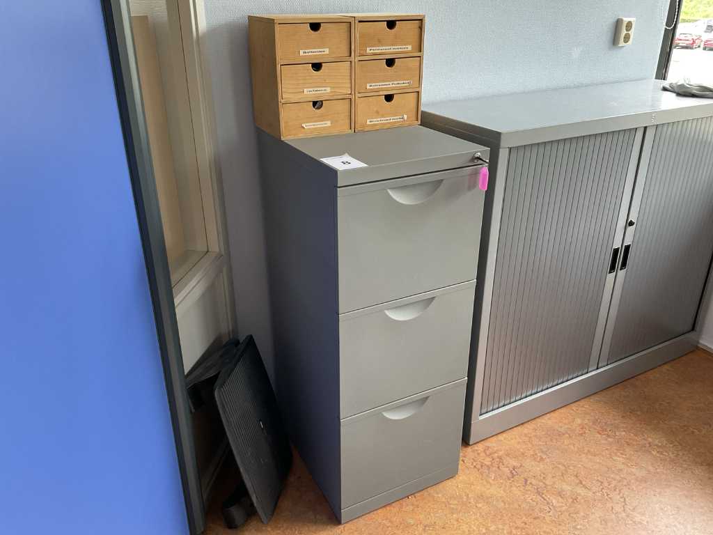 Filing cabinet with office supplies