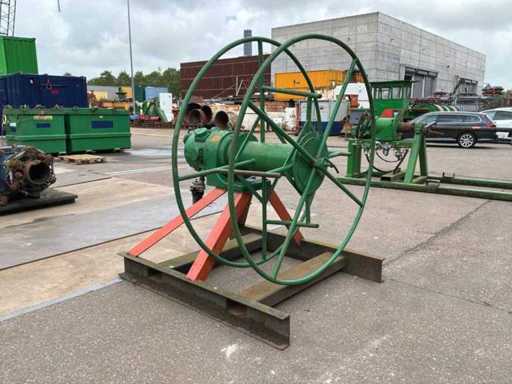 Pneumatic cable/hose reel wrapper.
