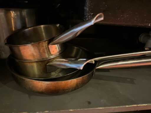 10 different cooking pots and 4 saucepans