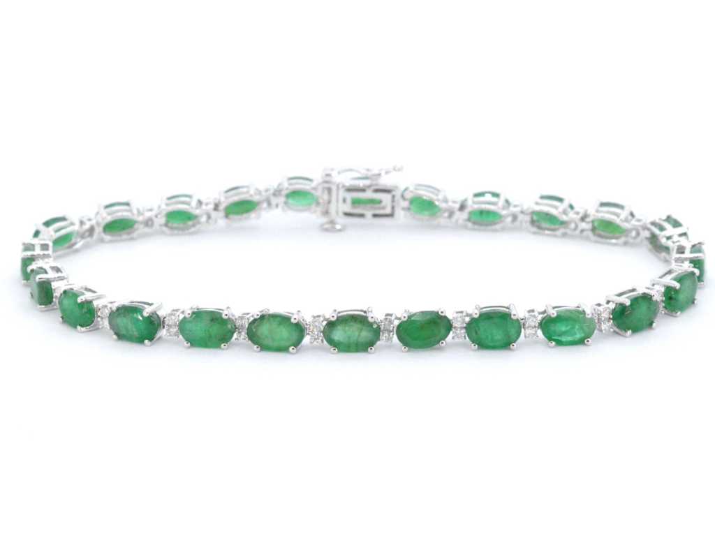 Witgouden tennisarmband met diamanten en smaragd