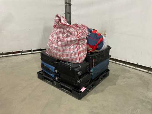 Suitcases and weekend bags with unknown contents