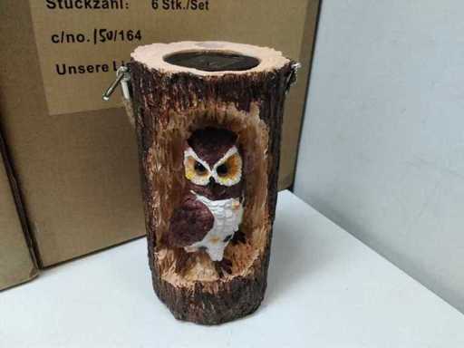 Owl on tree stump with solar energy (11x)
