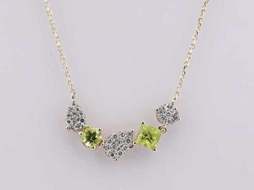 Collana in oro giallo da 14 nudi con ciondolo e diamanti naturali da 0,90 ct e peridoto