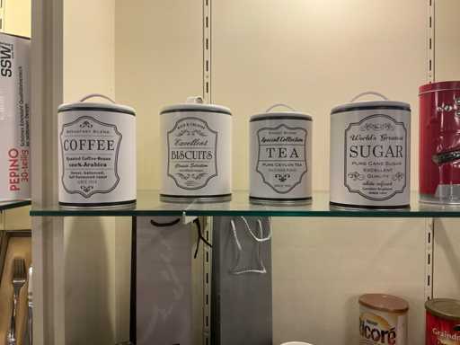 Various vintage storage boxes and kitchen utensils