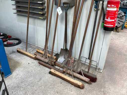 Various brooms and shovels