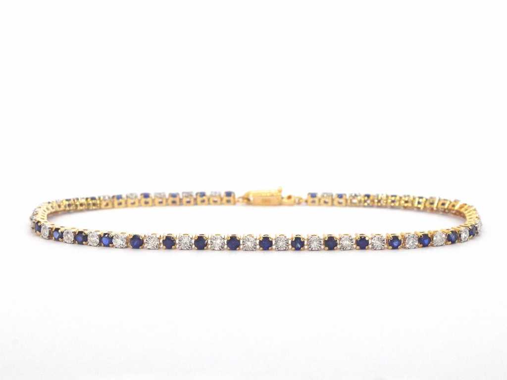 Gold tennis bracelet with diamonds and sapphires
