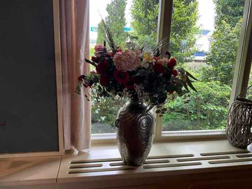 Artificial flowers in vase