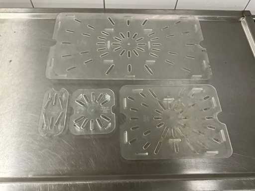 Batch of plastic gastronorm drain grids