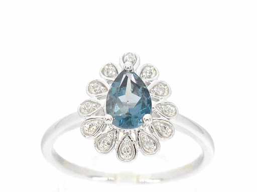 White gold ring with diamonds and topaz