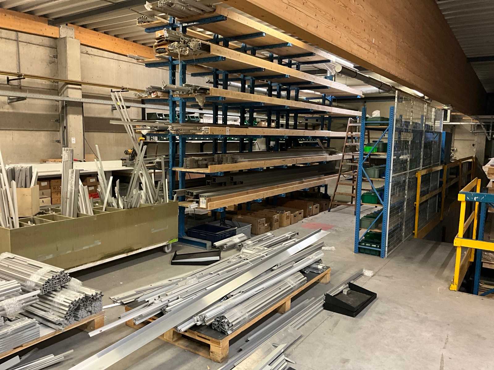 Large batch of aluminium profiles with mounting pieces in the attic