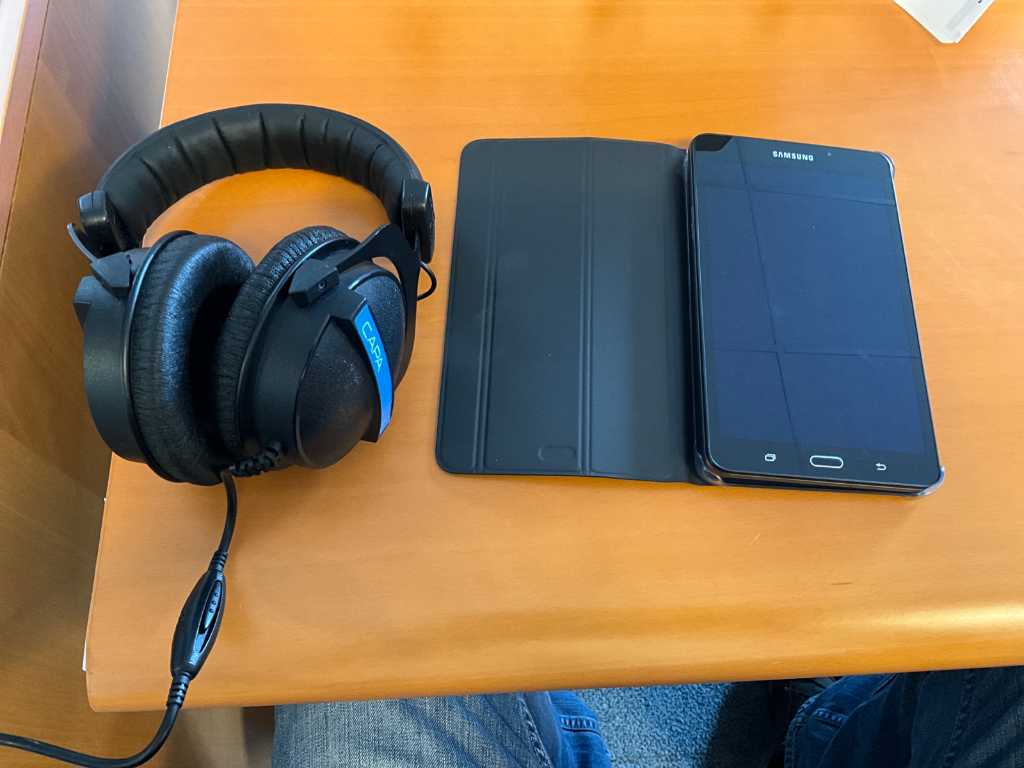 Samsung SM–T280 Galaxy Tap with headphones and case