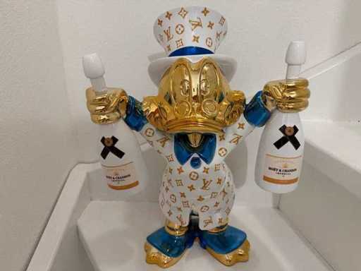 Sculptura lui Scrooge McDuck Moët & Chandon