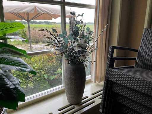 Vase with artificial flowers