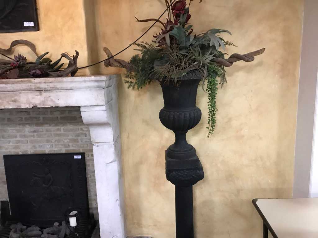 Cast iron vase on pedestal