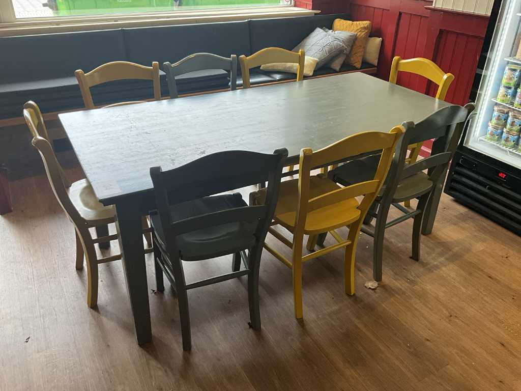 Wooden dining room table with 8 different chairs