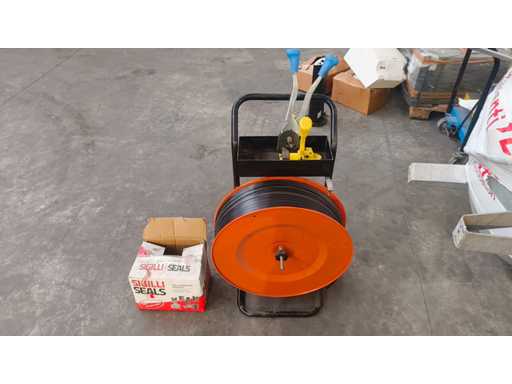   Reel carriage and strapping machine