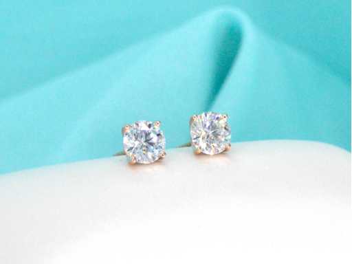 Rosegouden solitair oorbellen 2.00 ct diamanten