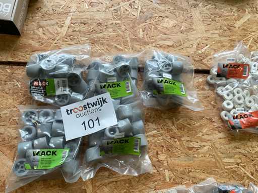 5 zakken met grijze deurstoppen