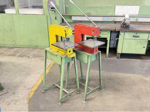   Two hand hole punches 