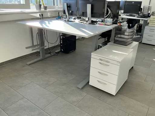 Height-adjustable desk with rolling container