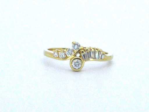 Gold punch ring with natural brilliant and baguette cut diamonds