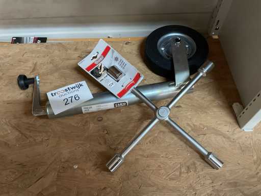 Moersleutel en aanhangwagen wiel