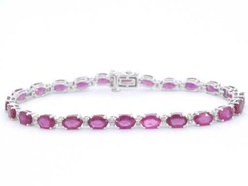 Witgouden tennisarmband met diamanten en robijn