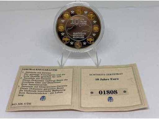 Cuivre plaqué argent avec plaquage partiel or – pièce commémorative irlandaise de 10 euros, diamètre de 40 mm.