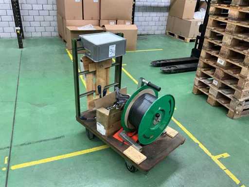 Strapping reel with tensioner