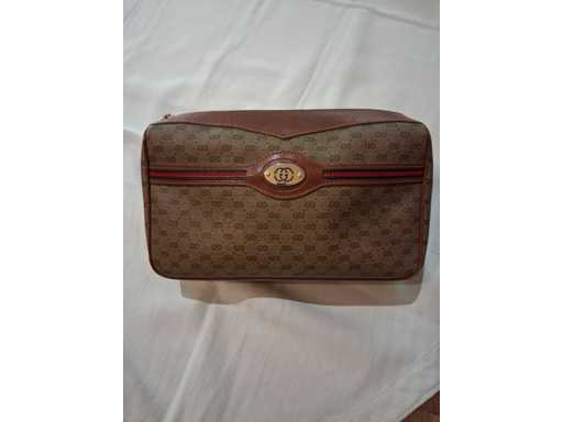 Gucci - Pochette in pelle con monogramma