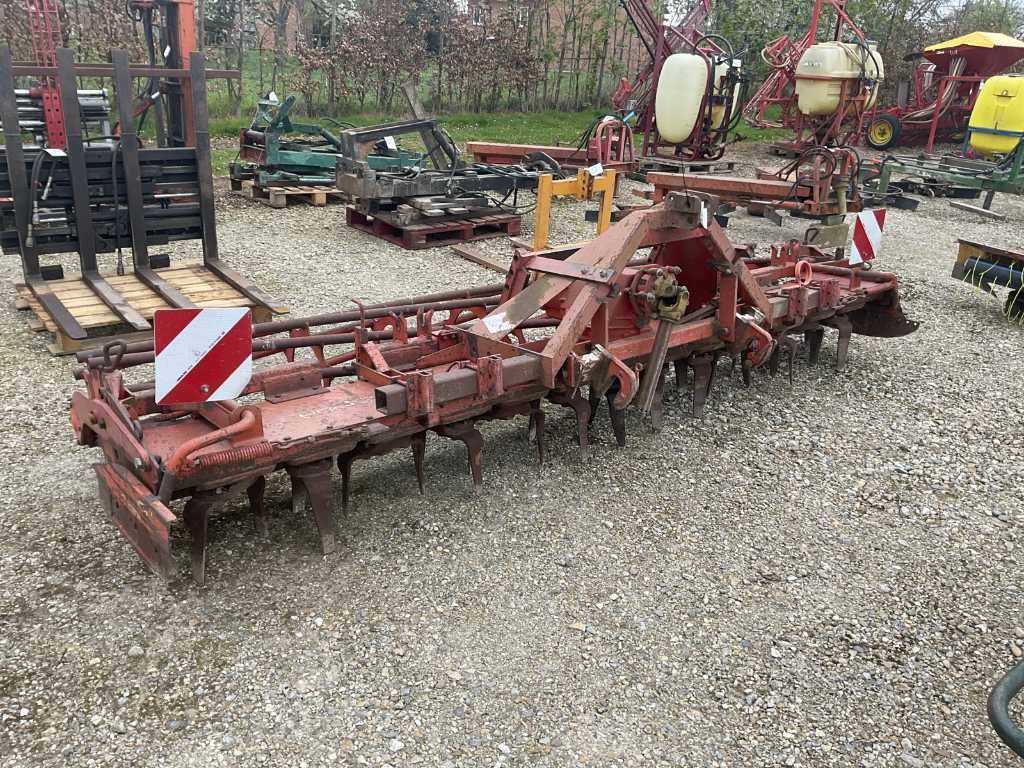 Power harrow with cage roller
