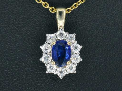 Gold entourage pendant with diamonds and sapphire